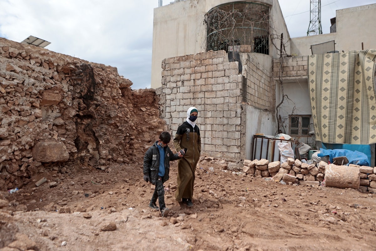 EU Civil Protection and Humanitarian AidFollow Northern Syria displacement camps: Not a place like home Wafaa and her son Abdullah walk among the remains of their home in the town of Sarmada situated in the northern countryside of Idlib, northwest Syria. The earthquake caused widespread damage to buildings, schools, and other essential infrastructure, exacerbating the already dire needs of millions of Syrians.  © European Union, 2023